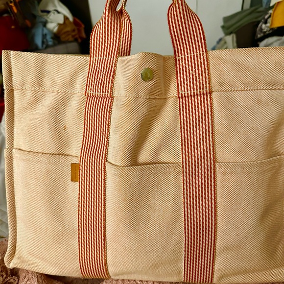 Hermes Handbags - Hermes Cream and Orange Canvas Tote with Black Logo Tag